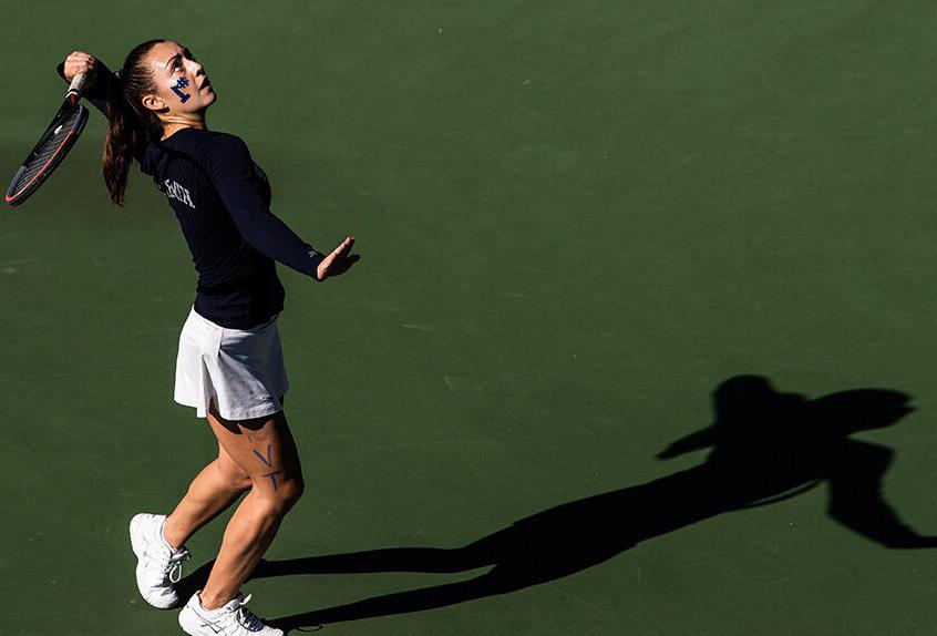 Girls Tennis player hitting the tennis ball